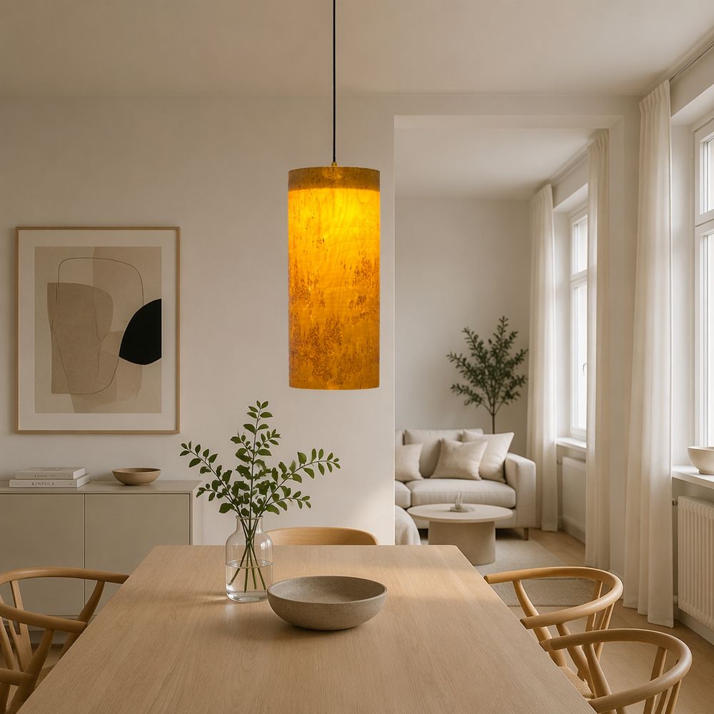 A single pendant above a light oak dining table